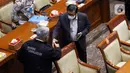 Menteri Hukum dan Hak Asasi Manusia Yasonna Laoly (kanan) saat menghadiri rapat kerja dengan DPR di Jakarta, Kamis (31/3/2022). Rapat terkait amandemen Undang-Undang No.35/2009 tentang Narkotika. (Liputan6.com/Angga Yuniar)