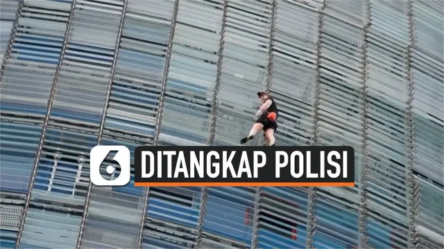 VIDEO: Seorang Pria ditangkap Setelah Mendaki Gedung Pencakar Langit di Barcelona