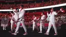 Kontingen Indonesia mengikuti defile dalam pembukaan Olimpiade Tokyo 2020 di Stadion Nasional Jepang, Tokyo, Jumat malam (23/7/2021). Indonesia menempati posisi urutan ke-22 dalam defile itu setelah kontingan India. Tim Merah Putih beranggotakan 10 orang. (Hannah McKay/Pool Photo via AP)