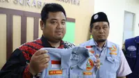 Ketua Pemuda Muhammadiyah Kota Surabaya, Alfianur Rizal Ramadhani angkat bicara soal rompi jeans biru yang dikenakan oleh Wali Kota Surabaya Eri Cahyadi.