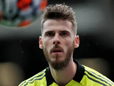 David De Gea masih kukuh mengawal gawang Manchester United hingga musim ini sejak didatangkan pada Juli 2011 dari Atletico Madrid meski belakangan sempat digoda untuk kembali ke LaLiga. Tercatat ia belum mampu digeser oleh 7 kiper pelapis Setan Merah. Siapa saja? (AFP/Adrian Dennis)