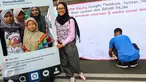 Warga pose saat aksi penandatanganan spanduk dukungan di Car Free Day Jalan MH Thamrin, Jakarta, Minggu (25/9). Aksi tersebut mengajak Facebook, Google, YouTube dan Twitter untuk bayar pajak. (Liputan6.com/Fery Pradolo)