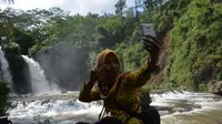 Sejumlah curug sudah dikelola dengan baik oleh pelaku wisata yang tergabung dalam Kelompok Sadar Wisata (Pokdarwis). (Liputan6.com/Aris Andrianto)