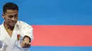 Karateka Indonesia, Ahmad Zigi Zaresta, tampil pada nomor kata cabang karate Asian Games XVIII di JCC Senayan, Jakarta, Sabtu (25/8/2018). Dirinya berhasil meraih medali perunggu. (Bola.com/Vitalis Yogi Trisna)