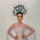 Di tengah permasalahan keuangan yang tengah dihadapinya dengan mantan suami, Tasya Farasya membagikan potret powerful dalam balutan gaun lilac. Ia mengenakan busana korset berbahan satin dengan atasan renda tembus pandang berkerah tinggi, dilengkapi lengan panjang berjuntai bak kain selendang dan peplum renda bergelombang di pinggang. Crown silver tinggi berhias mutiara dan kristal menjadi pusat perhatian di atas rambut yang ditarik rapi ke belakang. [@tasyafarasya]
