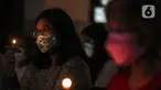 Jemaat mengikuti ibadah perayaan malam Natal di Gereja Protestan Indonesia Bagian Barat (GPIB) Effatha, Jakarta, Jumat (24/12/2021). Ibadah malam ini mengangkat tema Nyanyian Pujian. (Liputan6.com/Johan Tallo)