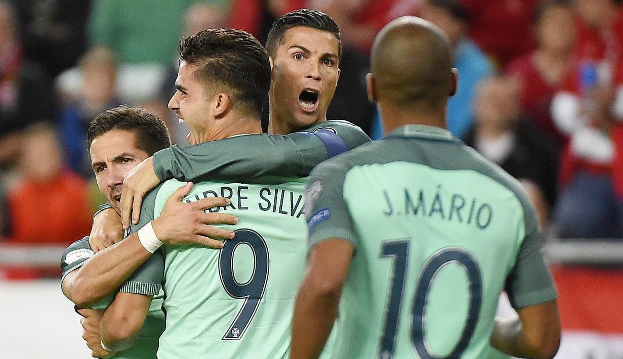 Portugal - Pasukan Fernando Santos memang layak diunggulkan pada Euro 2020 lantaran status mereka sebagai juara bertahan. Sosok Cristiano Ronaldo diprediksi masih bisa bicara banyak dan mampu membawa negaranya kembali menjadi juara. (AP/Tamas Kovacs)