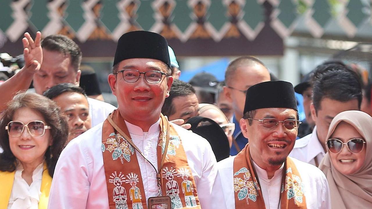 RK-Suswono tiba di Gedung KPU DKI Jakarta dengan wajah semringah.&nbsp;Foto: Liputan6.com/Angga Yuniar