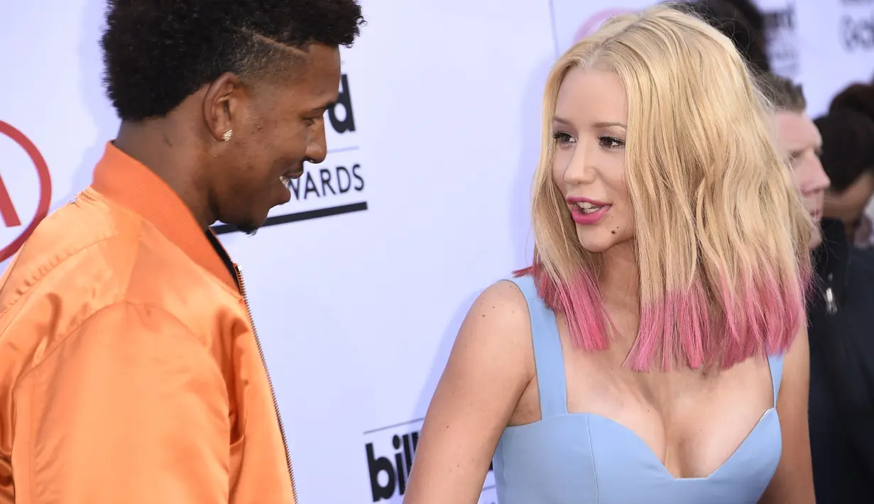 Iggy Azalea mengumumkan di Twitter bahwa ia berpisah dari Nick Young pada Juni 2016 usai mengetahui Nick selingkuh dan membawa wanita selingkuhannya ke rumah mereka. (ROBYN BECK / AFP)