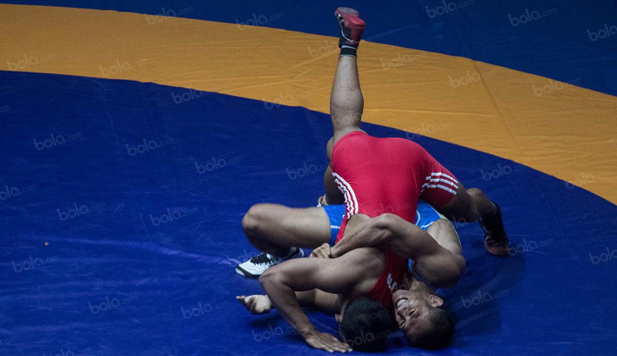 Namun akhirnya usaha Rudi Suandi berbuah manis, dirinya berhasil meraih medali emas. (Bola.com/Vitalis Yogi Trisna)