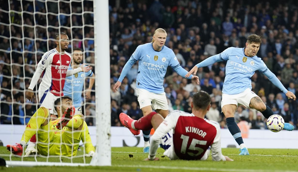 Gol Manchester City dicetak oleh Erling Haaland dan John Stones. Sementara itu gol Arsenal dipersembahkan Riccardo Calafiori dan Gabriel Magalhaes. (AP Photo/Dave Thompson)