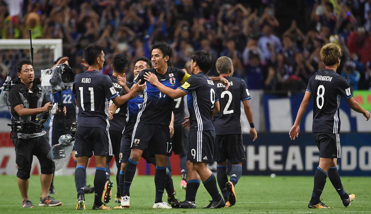 2. Jepang - Meski kalah pada laga terakhir melawan Arab Saudi, negeri samurai tetap menjadi juara Grup B pada babak kualifikasi dan lolos ke Piala Dunia. Sejak 1998, Jepang tidak pernah absen dari gelaran bergengsi World Cup. (AFP/Toru Yamanaka)