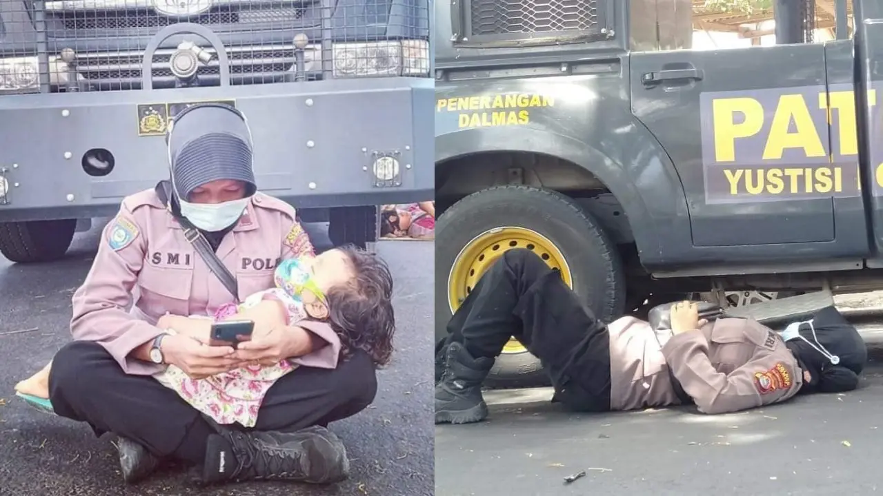 Foto polwan berjaga di kantor Bawaslu sambil menggendong putrinya viral. (Facebook Ismi N'dre)