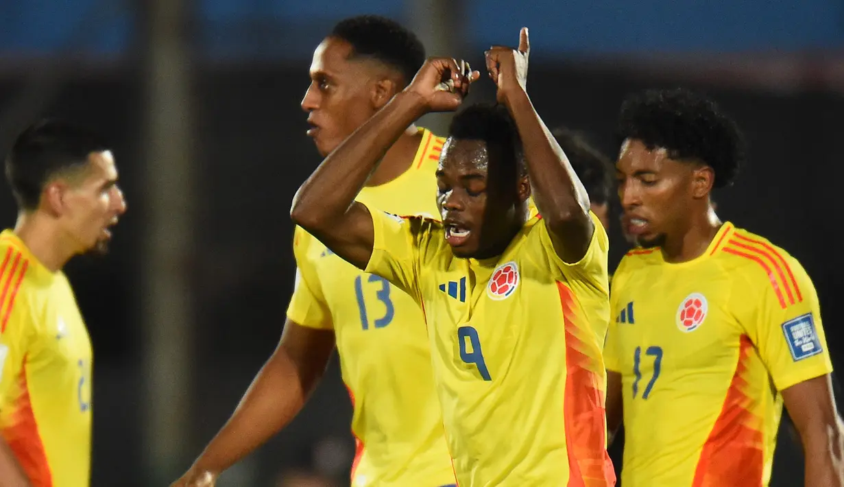 Pada masa tambahan waktu pertandingan, Kolombia berhasil menyamakan kedudukan setelah Andres Gomez mencetak gol penyeimbang di menit ke-90+6. (DANTE FERNANDEZ/AFP)
