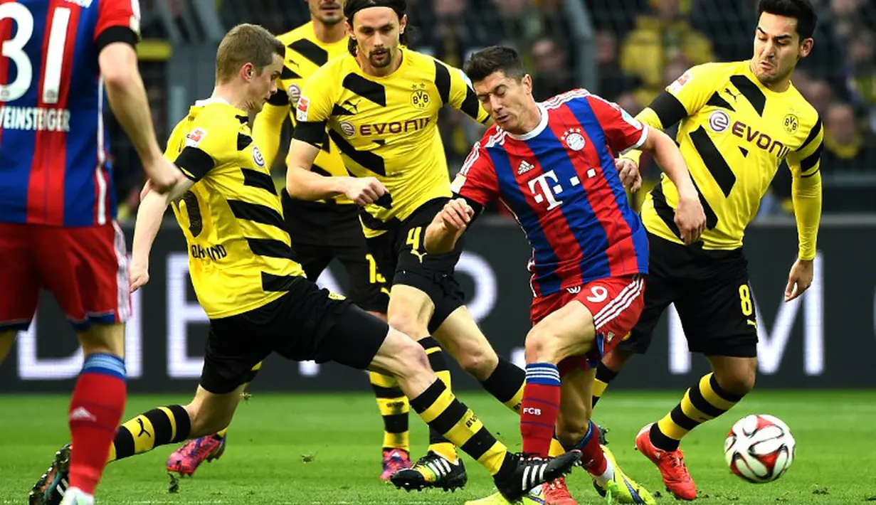 Borussia Dortmund sukses melenggang ke final DFB Pokal usai mengalahkan Bayern Muenchen melalui adu drama penalti (2-0), setelah hanya bermain imbang 1-1 hingga babak perpanjangan waktu. (AFP)