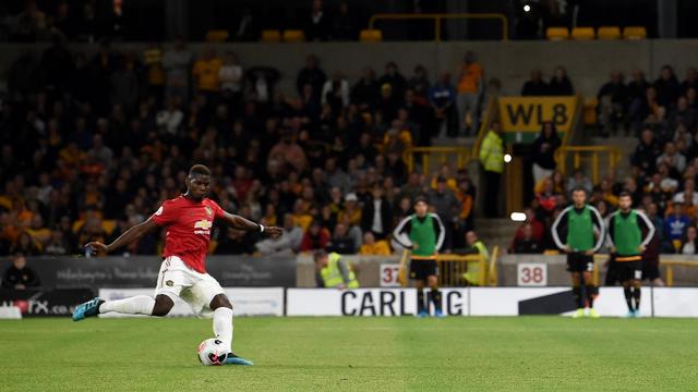 Gelandang Manchester United (MU), Paul Pogba (PAUL ELLIS / AFP)