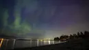 Seseorang mengambil foto Aurora Borealis atau Cahaya Utara di Vancouver, British Columbia pada Sabtu, 11 Mei 2024. (Ethan Cairns /The Canadian Press via AP)