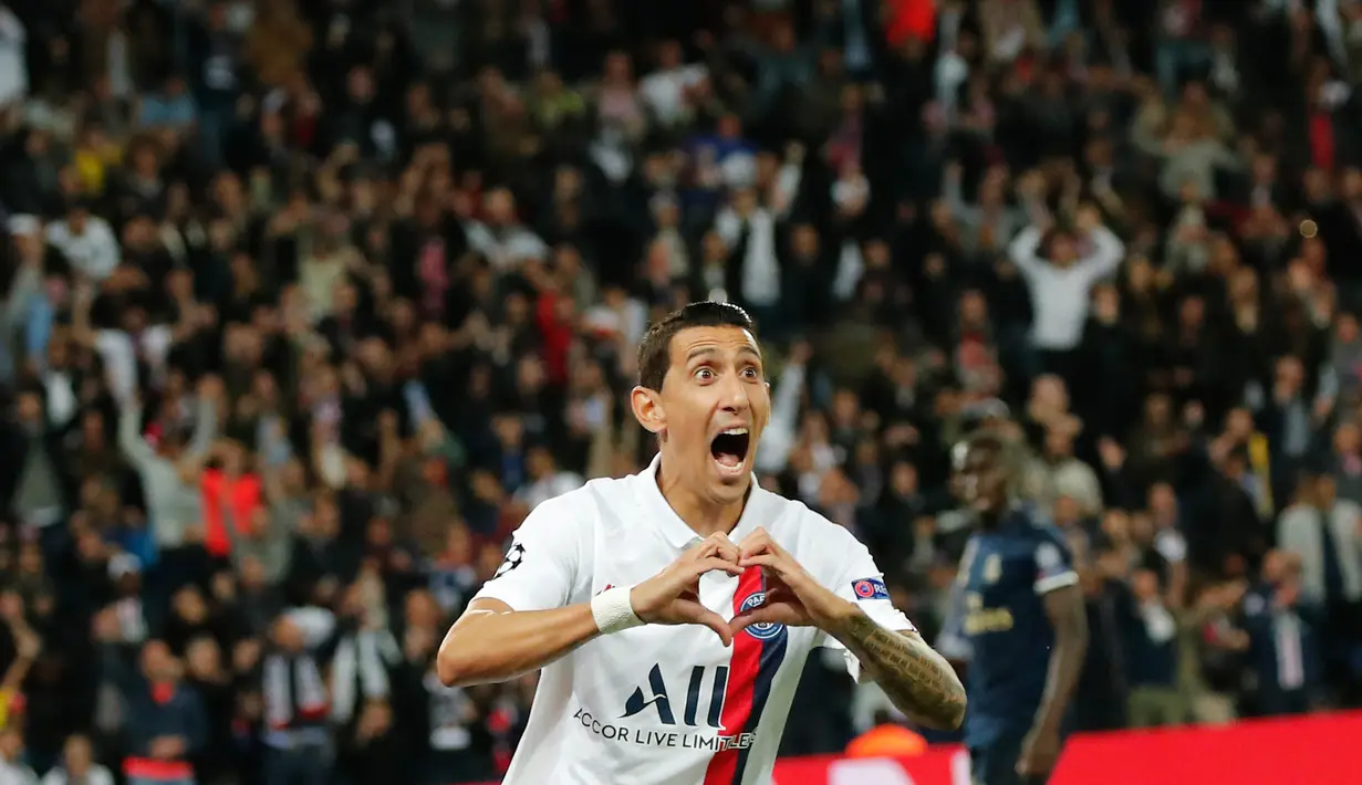 Pemain sayap Paris Saint-Germain (PSG), Angel Di Maria melakukan selebrasi usai mencetak gol ke gawang Real Madrid pada laga Grup A Liga Champions di Parc des Princes, Rabu (18/9/2019). PSG berhasil menaklukkan tamunya Real Madrid 3-0. (AP Photo/Francois Mori)