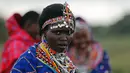 Ekspresi seorang atlet wanita dari suku Maasai saat melakukan persiapan untuk mengikuti Olimpiade Masai 2016 di cagar alam Sidai Oleng, kaki Gunung Kilimanjaro dekat perbatasan Kenya-Tanzania (10/12). (Reuters/Thomas Mukoya)