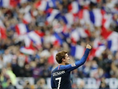 Penyerang Prancis, Antoine Griezmann, melakukan selebrasi usai membobol gawang Jerman pada laga UEFA Nations League di Stade de France, Paris, Selasa (16/10/2018). Prancis menang 2-1 atas Jerman. (AP/Christophe Ena)