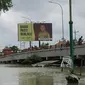 Jalur lalu lintas penghubung antara Kudus dengan Demak Jawa Tengah tergenag banjir. (Liputan6.com/ Arief Purnomo)