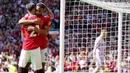 Pemain Manchester United, Anthony Martial, melakkukan selebrasi bersama Antony, setelah mencetak gol ke gawang Wolverhampton Wanderers pada laga pekan ke-36 Premier League di Old Trafford, Sabtu (13/5/2023). MU menang dengan skor 2-0. (AP Photo/Jon Super)