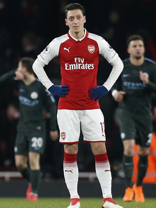 Pemain yang mengidolakan Zidane tersebut mampu tampil stabil ditengah kelabilan Arsenal musim ini. Imbasnya the Gunners gagal memastikan diri mentas di kancah Liga Champions 2018/2019. (AFP/Ian Kington)