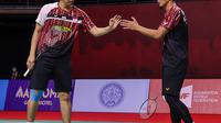 Ganda putra Indonesia Hendra Setiawan/Mohammad Ahsan mengalahkan pasangan Inggris Marcus Ellis/Chris Langridge pada babak pertama Toyota Thailand Open 2021 di Impact Arena, Bangkok, Rabu, 19 Januari. (foto: BWF-limited acces)