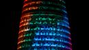Proyeksi cahaya warna pelangi menerangi gedung pencakar langit Torre Agbar saat peringatan World Pride di Barcelona, Spanyol, 28 Juni 2017. World Pride merupakan acara perayaan LGBT terbesar di dunia yang diadakan setiap tahun. (AP/Manu Fernandez)