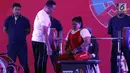 Atlet Para Powerlifting Indonesia, Siti Mahmudah bersiap melakukan angkatan beban di kelas Womens Up 79kg Asian Para Games 2018 di Jakarta, Rabu (10/10). Siti Mahmudah meraih perak dengan total angkatan 120 kg. (Liputan6.com/Helmi Fithriansyah)
