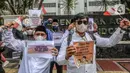Aksi unjuk rasa dilakukan secara tertib dan damai dengan kawalan sejumlah petugas keamanan. (Liputan6.com/Herman Zakharia)