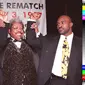 Mike Tyson dan Evande Holyfield bersama promotor tinju dunia Don King (Timothy A Clary/AFP)