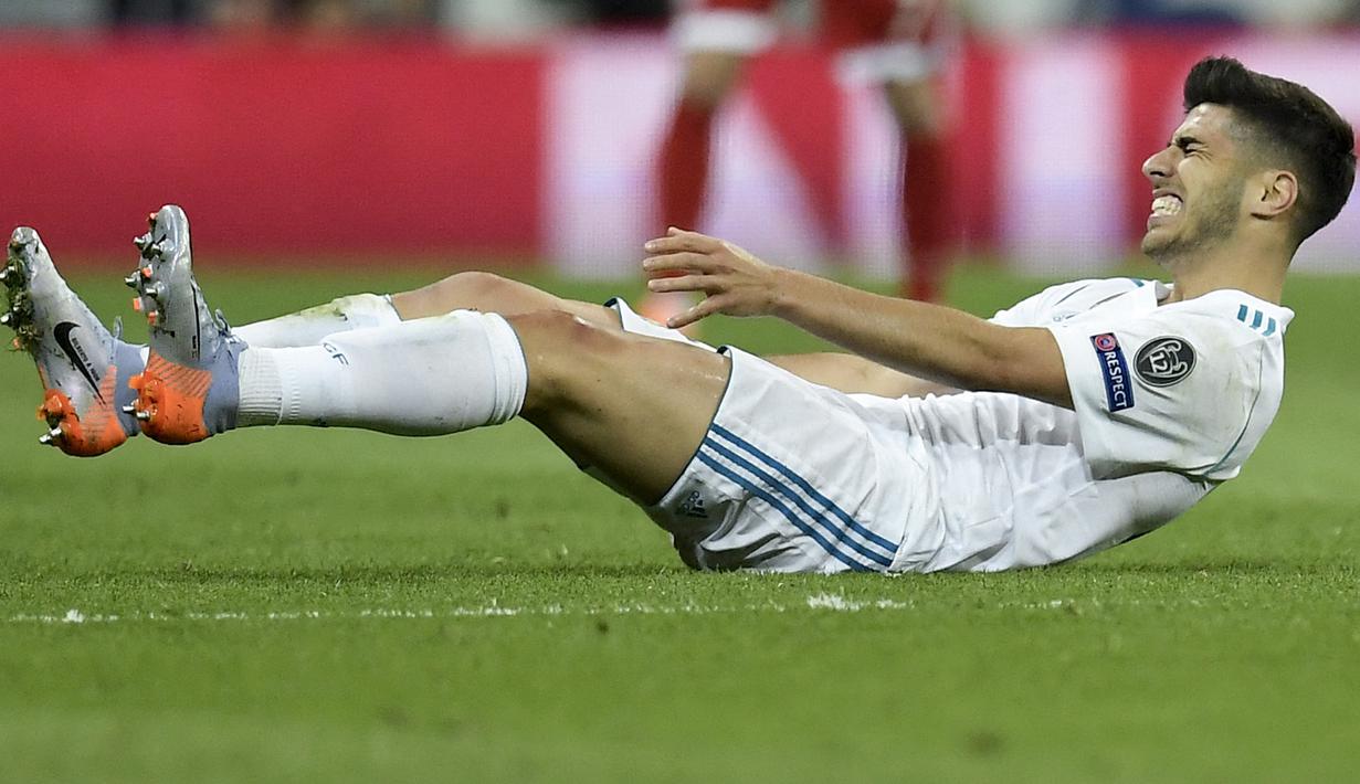 <p>Marco Asensio. Gelandang Real Madrid gagal melakukan debut usai mengalami cedera yang disebabkan oleh infeksi pori-pori kakinya usai mencukur bulu kaki. (AFP/Oscar Del Pozo)</p>