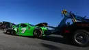 Mobil Danica Patrick, Chevrolet GoDaddy 7 diderek usai mengalami tabrakan di arena perlombaan balap Nascar Daytona 500 Cup di Daytona International Speedway (18/2). (Sarah Crabill/Getty Images/AFP)