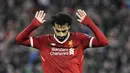 Striker Liverpool, Mohamed Salah, tidak melakukan selebrasi usai mencetak gol ke gawang AS Roma pada leg pertama semifinal Liga Champions di Stadion Anfield, Selasa (24/4/2018). Liverpool menang 5-2 atas AS Roma. (AP/Rui Vieira)