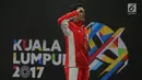 Pebulu tangkis putra Indonesia Jonatan Christie saat merayakan kemenangan pada final tunggal putra SEA Games 2017 melawan Khosit Phetpradab dari Thailand di Axiata Arena, Malaysia, Selasa (29/8). (Liputan6.com/Faizal Fanani)