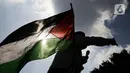 Massa Gerakan Pekerja Muslim Indonesia (GPMI) melakukan aksi solidaritas untuk Palestina di kawasan Thamrin Jakarta, Jumat (28/5/2021). Mereka menyuarakan keprihatinan atas tragedi kemanusiaan di Palestina, serta mewujudkan perdamaian dunia dan kemerdekaan atas Palestina (Liputan6.com/Faizal Fanani)