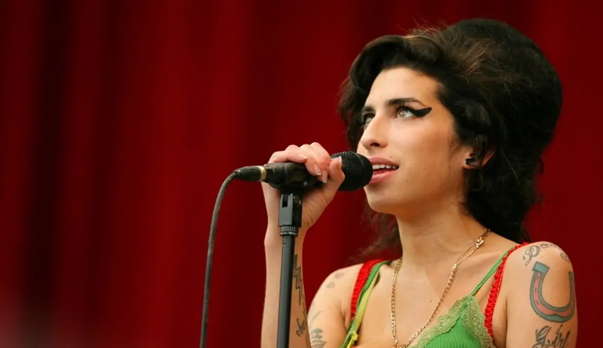 Amy Weinhouse meninggal karena keracunan alkohol pada 23 July 2011. (CARL DE SOUZA / AFP)