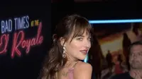 Dakota Johnson dan Chris Martin memiliki tato yang sama. (Michael Tullberg / AFP)