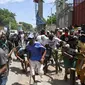 Seruan dari Human Rights Watch ini muncul ketika Haiti menunggu tanggapan dari Dewan Keamanan PBB atas permintaannya di bulan Oktober lalu, untuk segera mengirimkan pasukan bersenjata internasional untuk melawan lonjakan kekerasan dan kriminalitas yang tak mampu lagi ditangani petugas keamanan negara itu. (Richard PIERRIN/AFP)