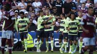 Skor 2-0 pun bertahan hingga akhir laga. Sang juara bertahan Manchester City berhasil mencuri poin tiga di kandang West Ham. (AP/Frank Augstein)