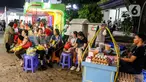 Warga menikmati suasana hari pertama Pekan Raya Jakarta atau Jakarta Fair 2025 di JIExpo Kemayoran, Jakarta, Kamis (19/6/2025). (Liputan6.com/Herman Zakharia)