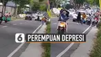 Aksi perempuan berjalan santai di tengah jalan menuju destinasi wisata Telaga Sarangan, Kabupaten Magetan, Jawa Timur membuat jalanan sempat macet dan terhambat.