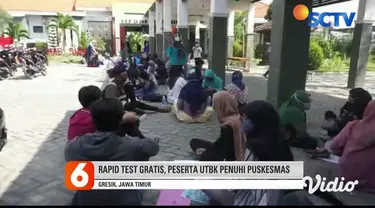 Para peserta ujian tertulis berbasis komputer rela mengantri di Rumah Sakit PKU Muhammadiyah Surabaya. Mereka akan menjalani rapid test, sebagai salah satu syarat untuk bisa mengikuti UTBK Seleksi Bersama Masuk Perguruan Tinggi Negeri.