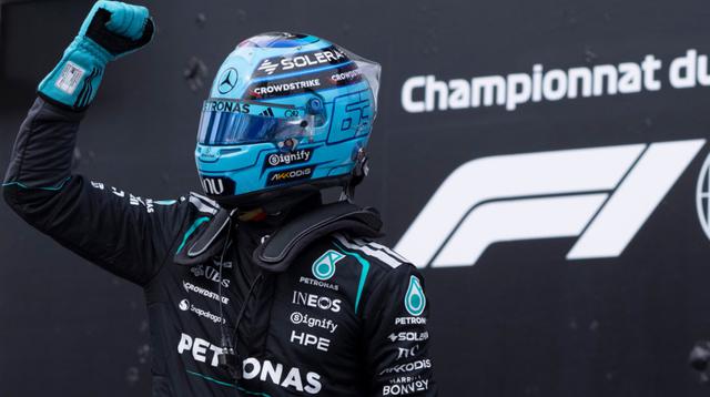 Pembalap Mercedes, George Russell, asal Inggris, merayakan keberhasilannya meraih pole position setelah kualifikasi untuk balapan mobil F1 Grand Prix Kanada di Montreal, Sabtu, 23 Mei 2026. (Christinne Muschi/The Canadian Press via AP)