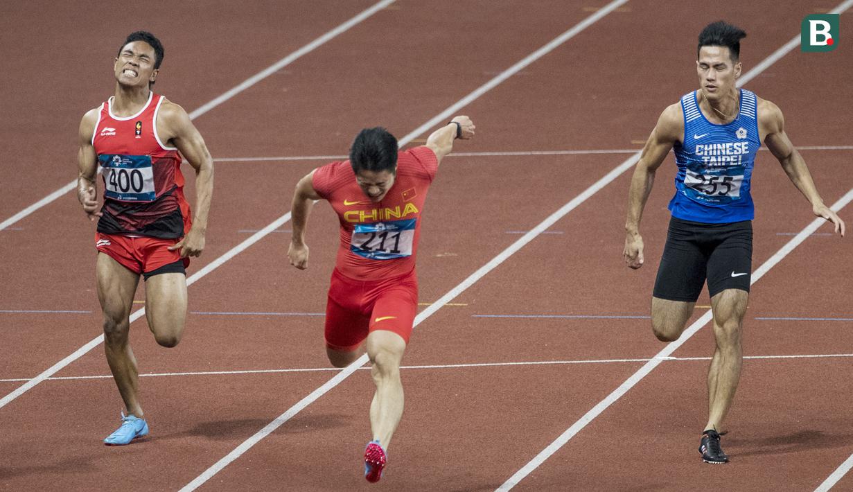 Pelari Indonesia, Lalu Muhammad Zohri, saat berlaga pada nomor 100 meter Asian Games di SUGBK, Jakarta, Minggu (26/8/2018). Lalu Zohri finish di urutan ke tujuh dengan catatan waktu 10,20 detik. (Bola.com/Vitalis Yogi Trisna)