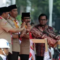 Presiden Joko Widodo saat membuka acara Peringatan Hari Pramuka dan Pembukaan Raimuna Nasional XI Gerakan Pramuka di Bumi Perkemahan Cibubur, Jakarta, Senin (13/8). (Liputan6.com/Faizal Fanani)