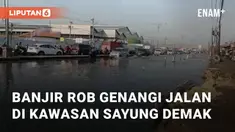 Banjir rob menggenangi jalan di Sayung, Demak, Minggu (29/9/2024) pagi. Ketinggian banjir di wilayah tersebut bervariasi, antara 20 hingga 30 cm