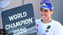Pembalap Suzuki Ecstar, Joan Mir tersenyum saat merayakan Juara Dunia 2020 usai balapan di MotoGP Valencia di Sirkuit Ricardo Tormo di Valencia, Spanyol, Minggu (15/11/2020). (AFP/Lluis Gen)