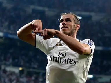 Selebrasi gelandang Real Madrid, Gareth Bale usai mencetak gol ke gawang AS Roma pada pertandingan Grup G Liga Champions di Stadion Santiago Bernabeu, Madrid, Spanyol, Rabu (19/9). Madrid membantai Roma 3-0. (AP Photo/Manu Fernandez)